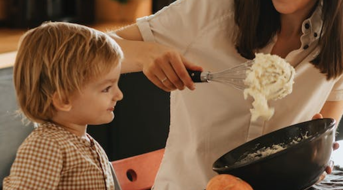 Mother cooking with child