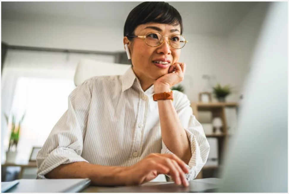 Woman looking attentively at computer
