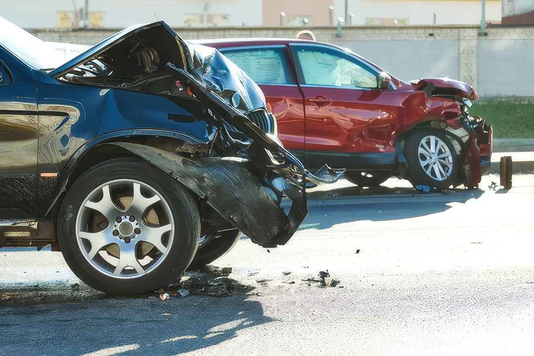 A scene of a car accident between two cars.