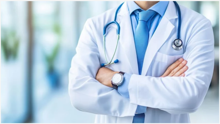 Doctor in a white coat with arms crossed