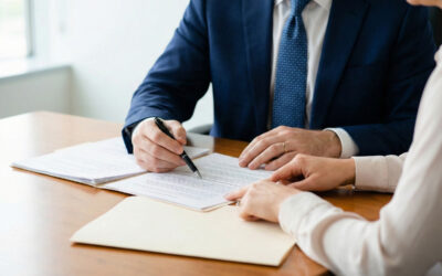 Finding-an-Experienced-Lawyer-for-a-TBI-Case-image Attorney reviewing legal documents during a client consultation