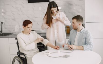 blog-hero-medicaid-tbi-homecare-7446757 Caregiver helping a family member in a wheelchair at home, representing Medicaid home and community-based care after a TBI