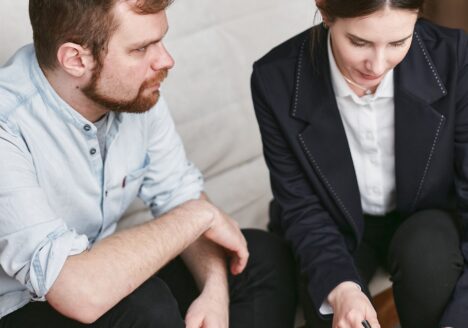 An attorney reviewing legal documents with a client after a traumatic brain injury